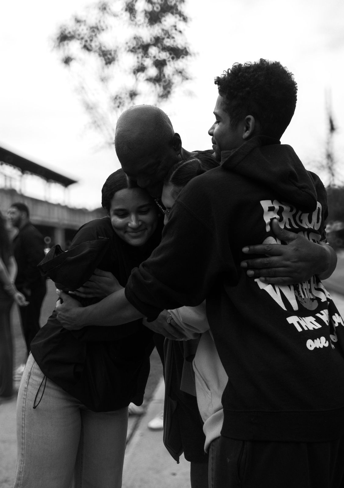 A group hug during outreach